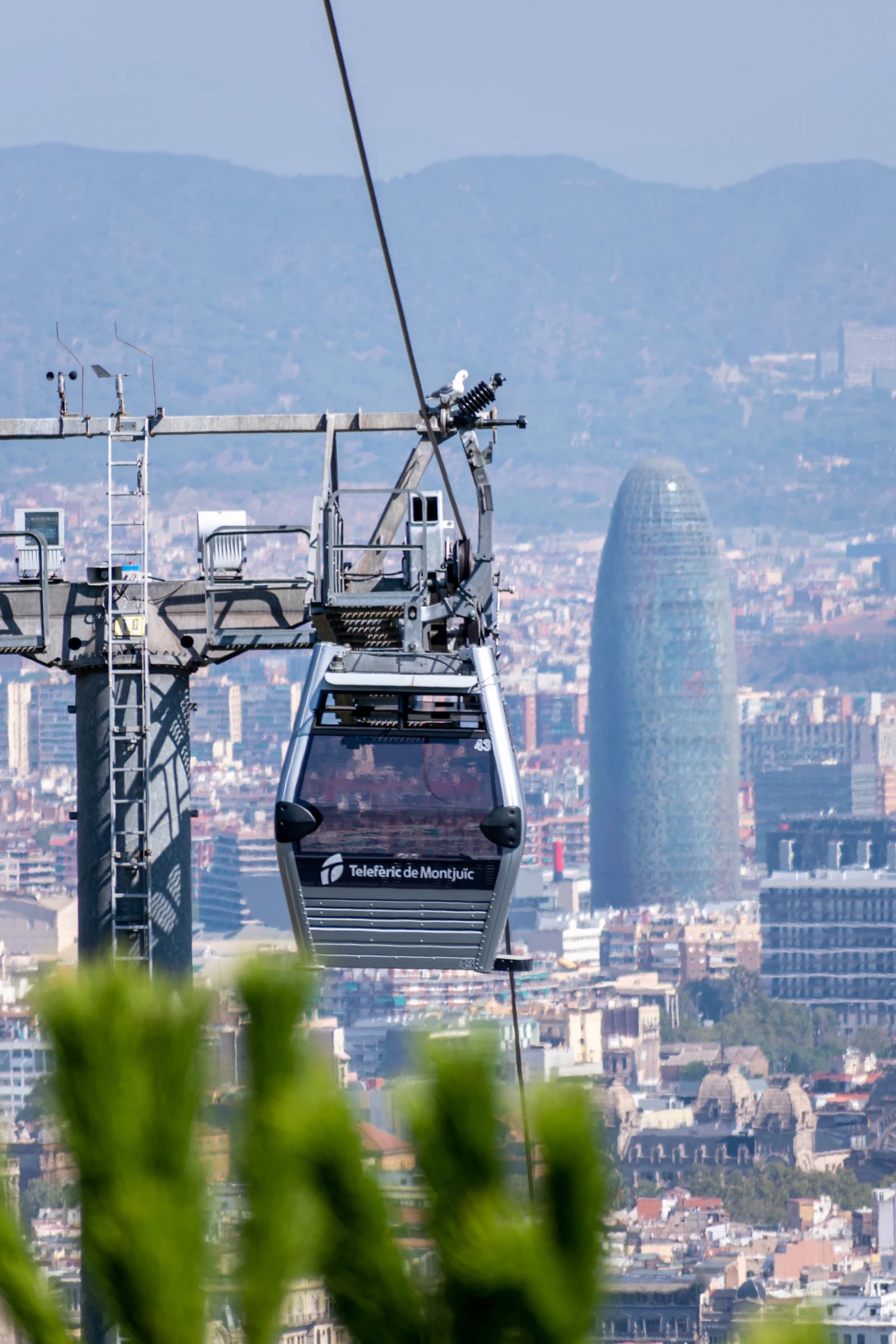 A cable-car cabin above Barcelona viewed from Montjuïc