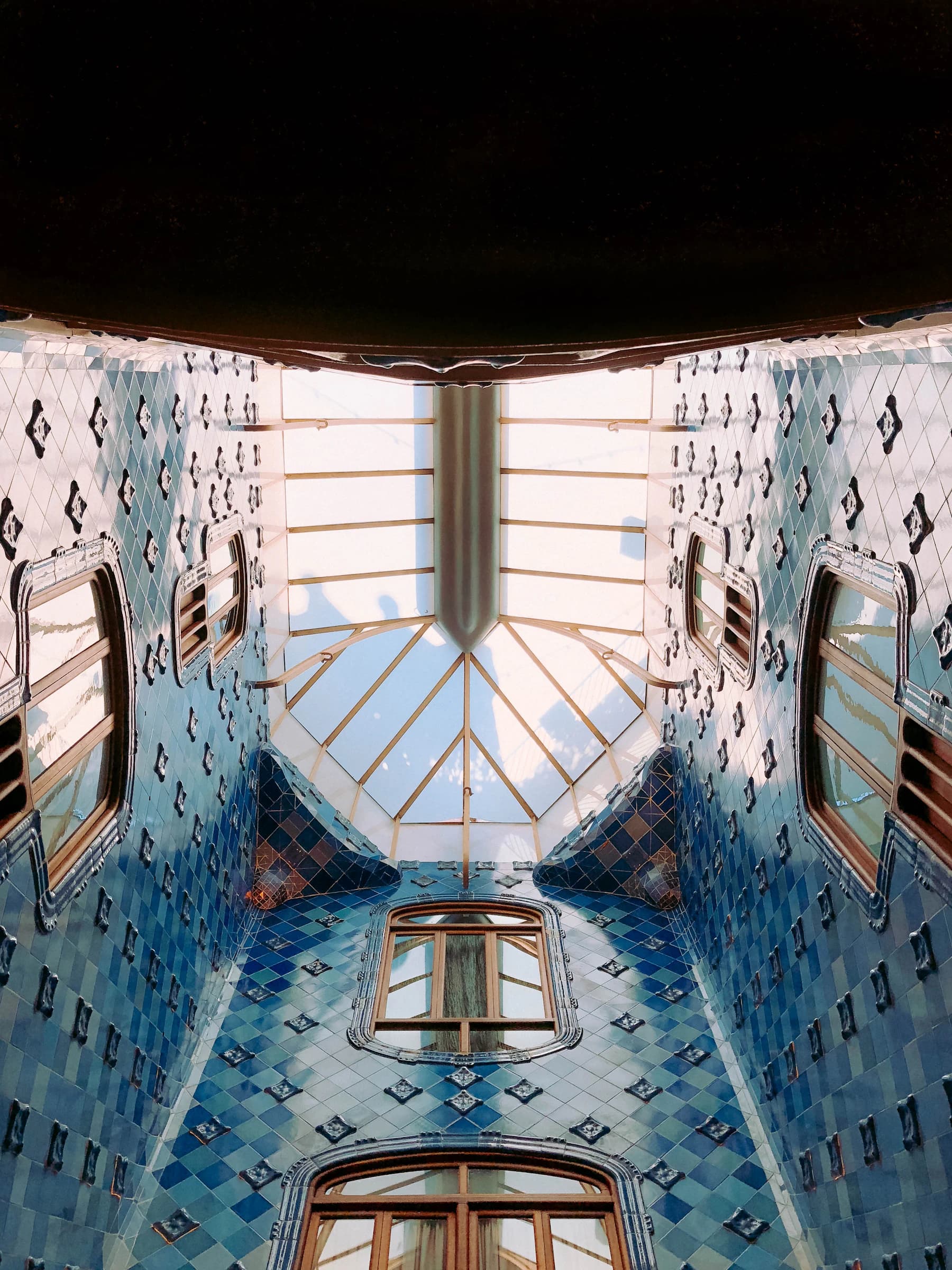 The blue-tiled light well inside Casa Batlló